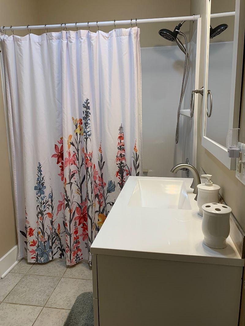 Primary bedroom's bathroom. Full shower/tub.
