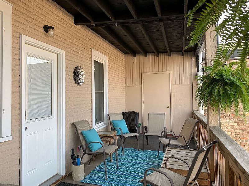 Relax on your porch! Plenty of seating. Door on the left is the entry into the kitchen. Kwikset electronic door lock - no need to carry keys.