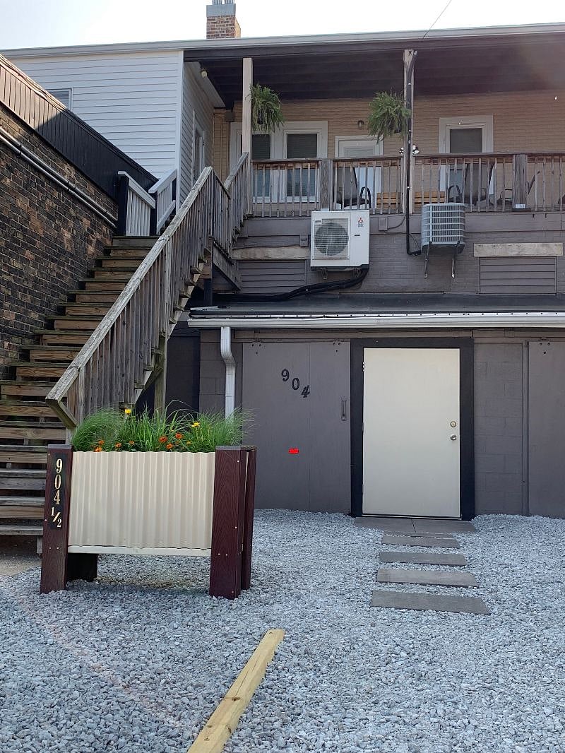 Your reserved parking space and the exterior stairs to the loft's porch and entry door.