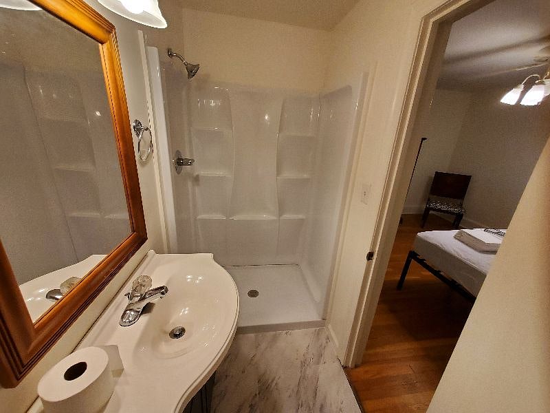 Master bedroom (east end) has its own shower bath, all new.
