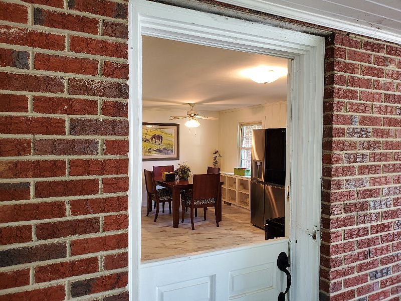 View from screened porch into kitchen through vintage Dutch door.
