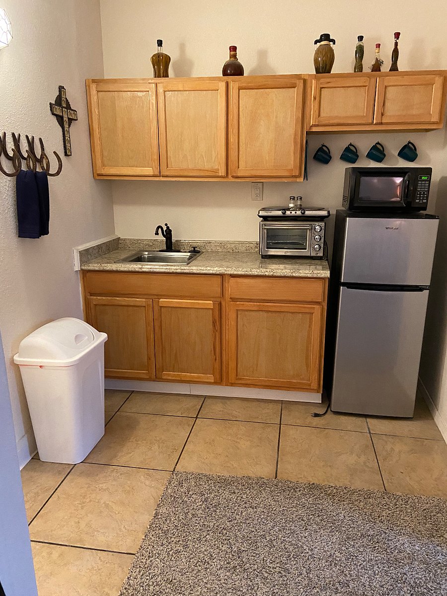 Old fridge replaced by new full size fridge in picture 4.
