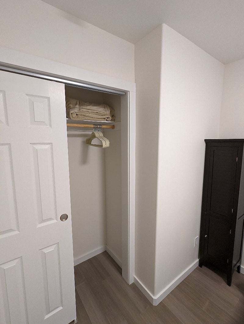 Closet and dresser in bedroom