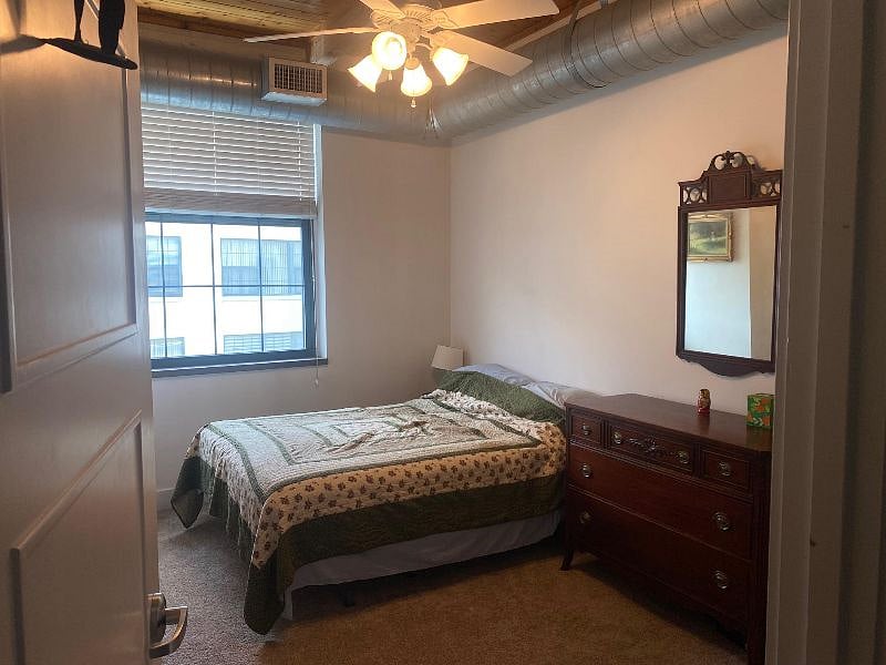 Bedroom with a walk-in closet and dressers