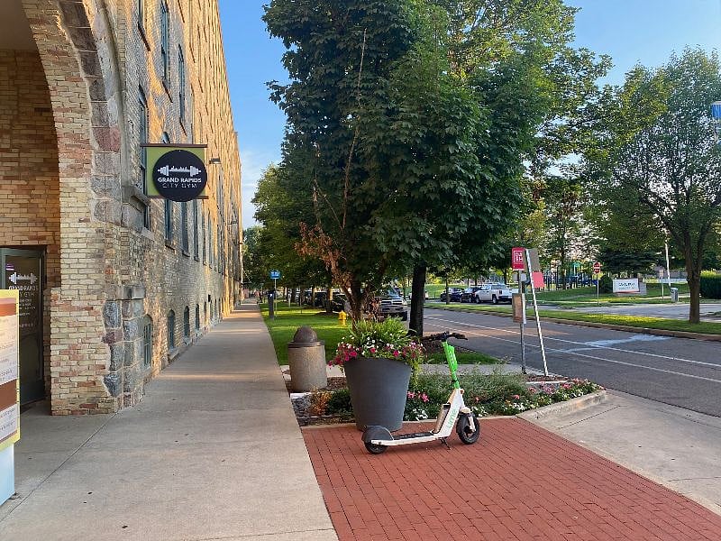 sidewalk view from condo towards cafe, microbrewery, restaurants, stops etc. Corewell Heath (Spectrum) is 1/4 mile south of here