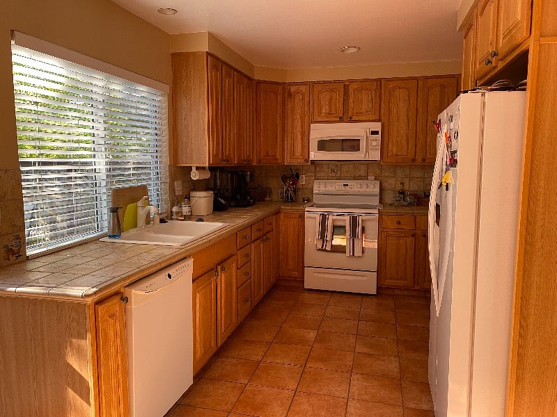 Fully stocked kitchen with dishwasher, microwave/convection oven, refrigerator with ice and water dispenser, electric stove. 