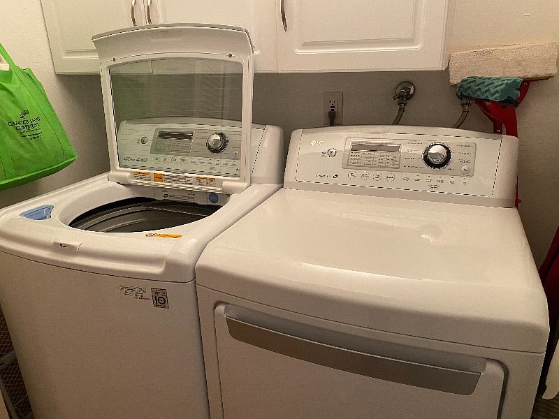 Washer dryer in unit. Full size ironing board and iron.