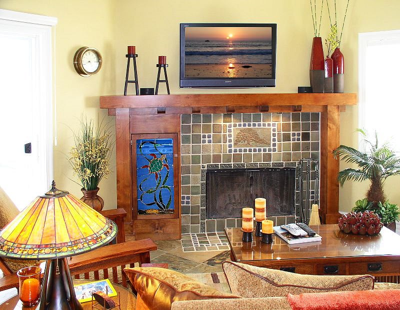 Den with wood fireplace