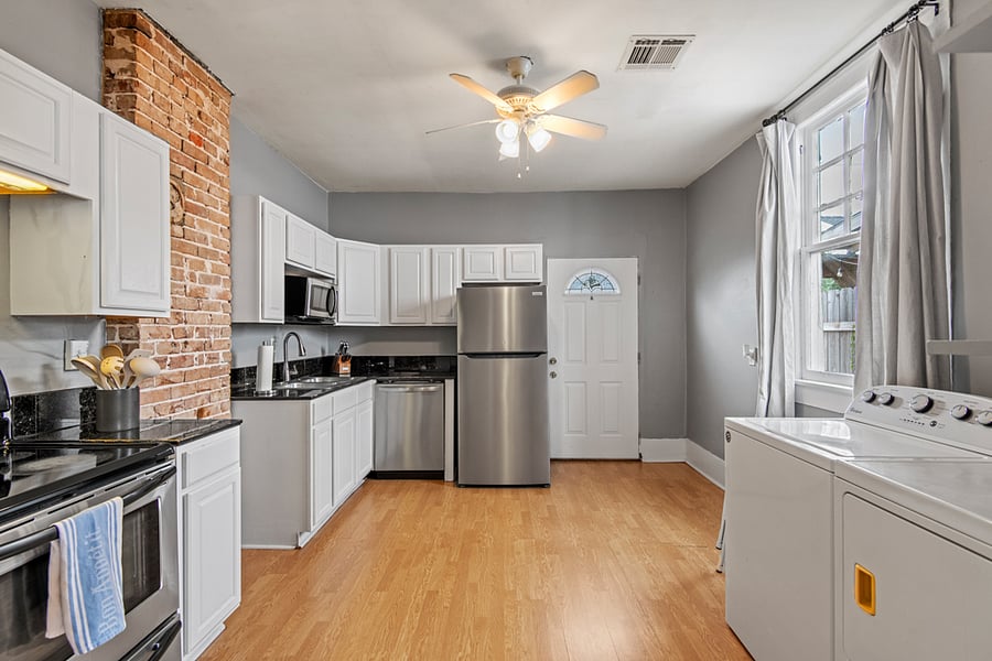 The shotgun style tradition is kitchen in the back! This bright kitchen space has everything you need to cook, clean, and feel the comforts of home.