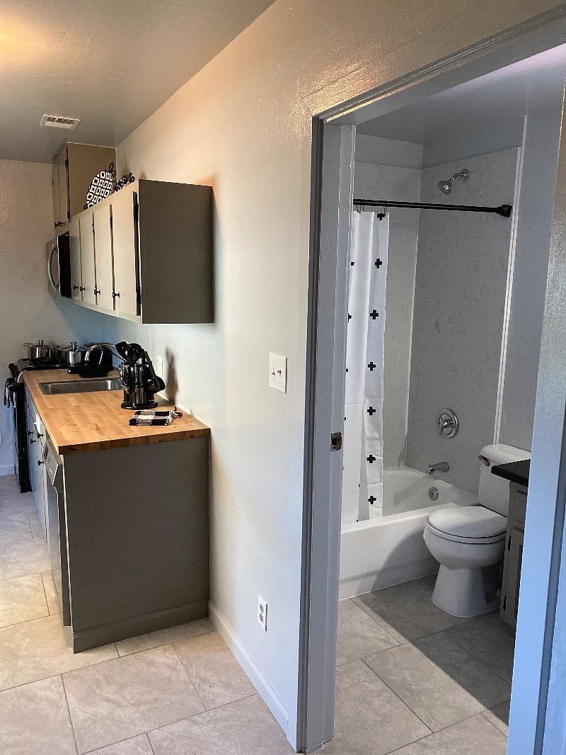View into kitchen and bathroom from bedroom 