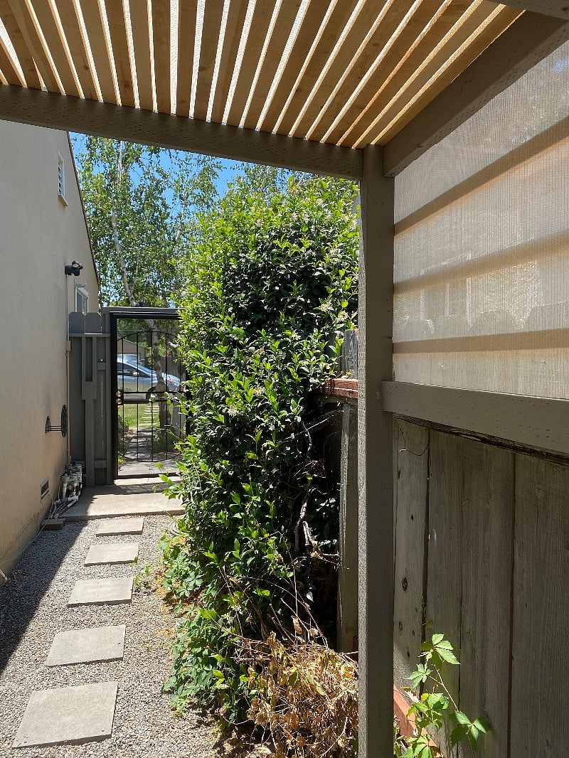 Looking through security gate to front street 