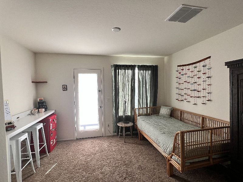 Private den with coffee bar and balcony access