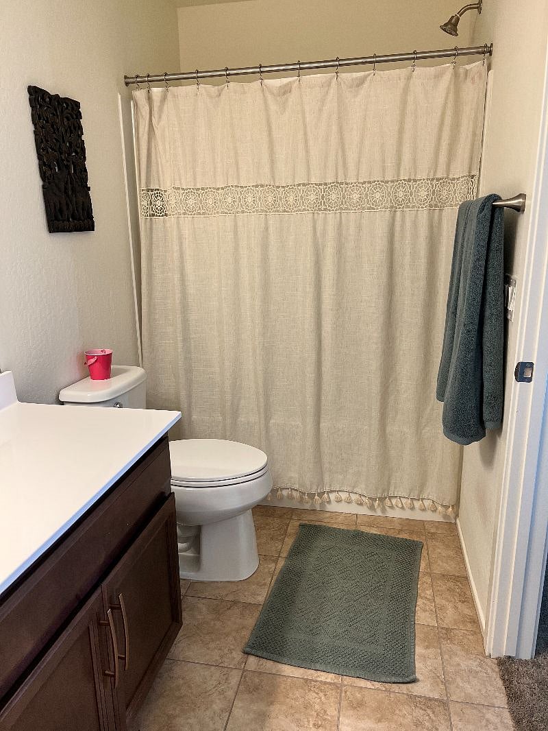 Private bathroom with shower and bath tub