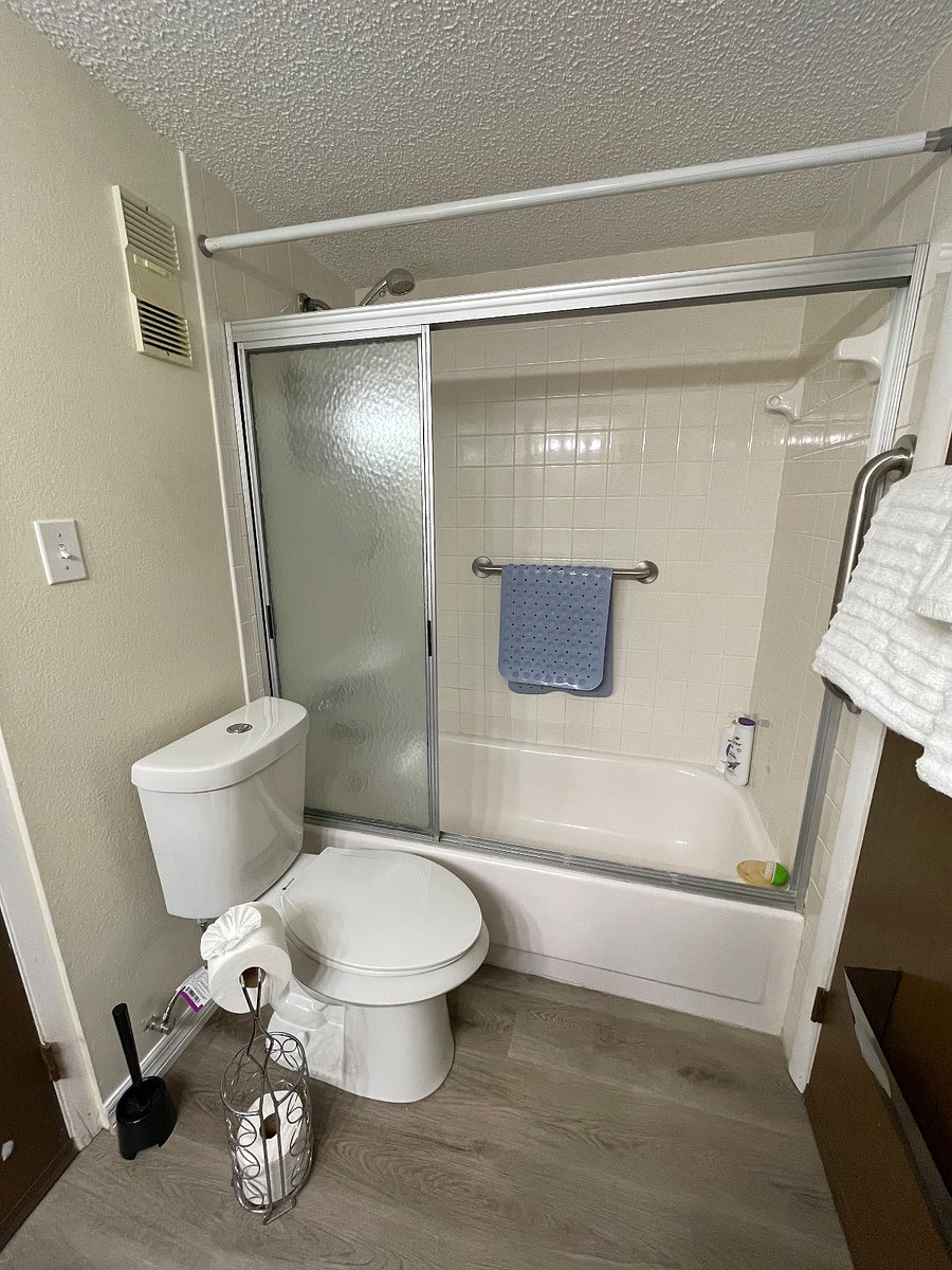 Handicap bars in place for tub/shower bathroom.