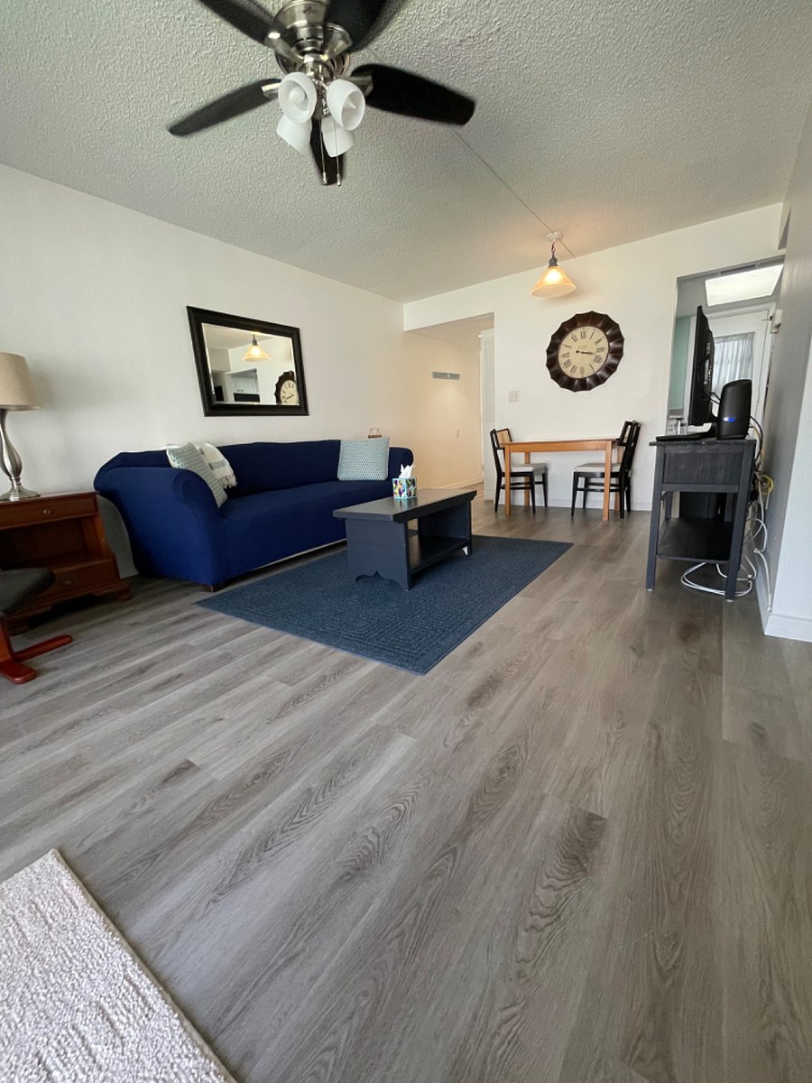 New flooring in spacious living room.