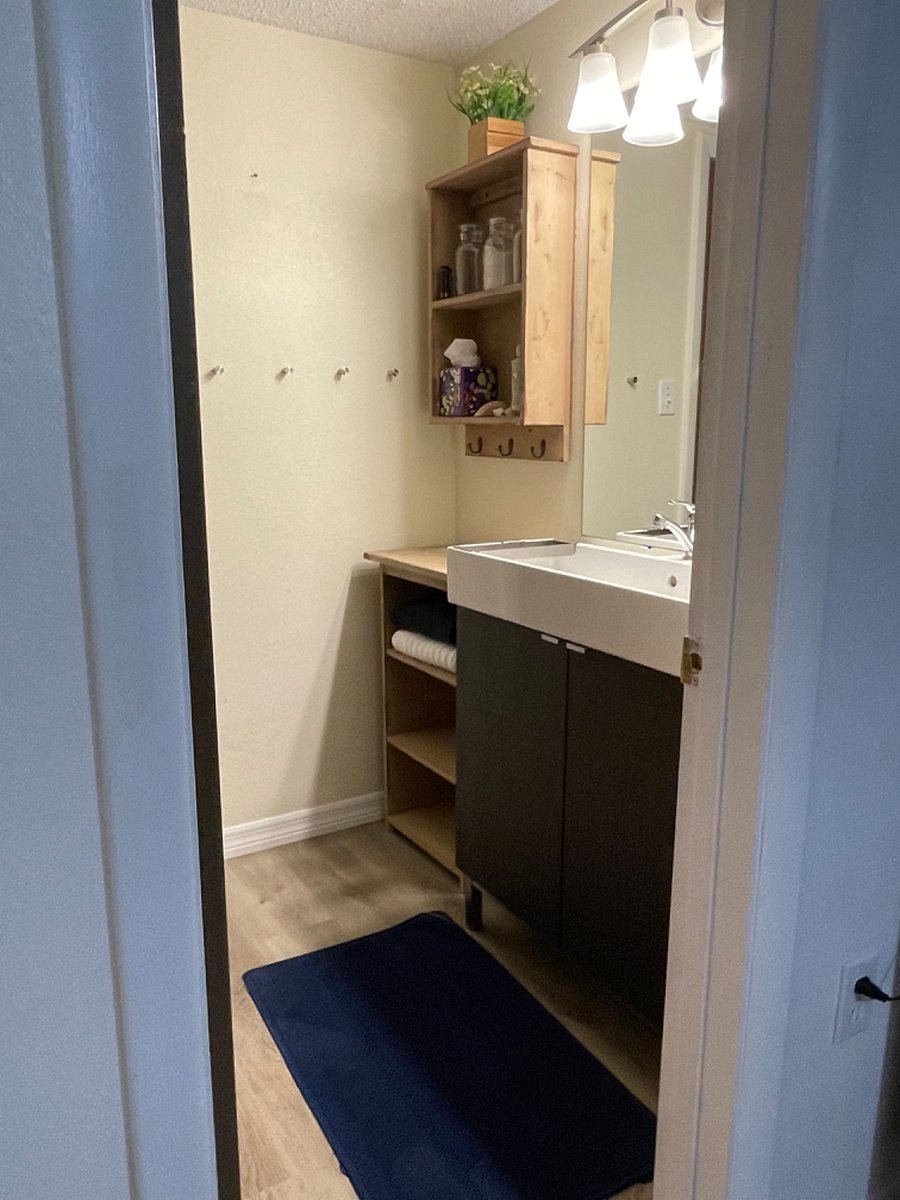 updated vanity and storage in full bath