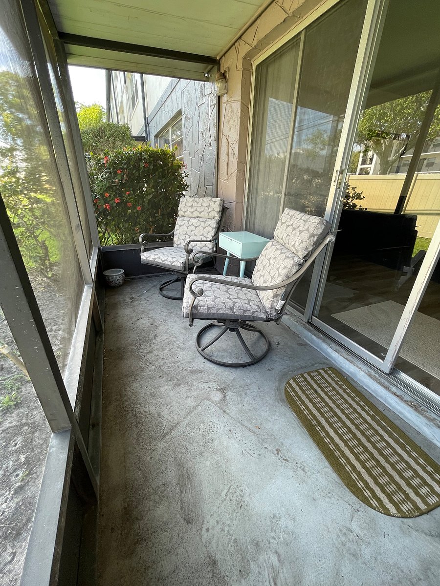enjoy the outdoors in this screened in patio