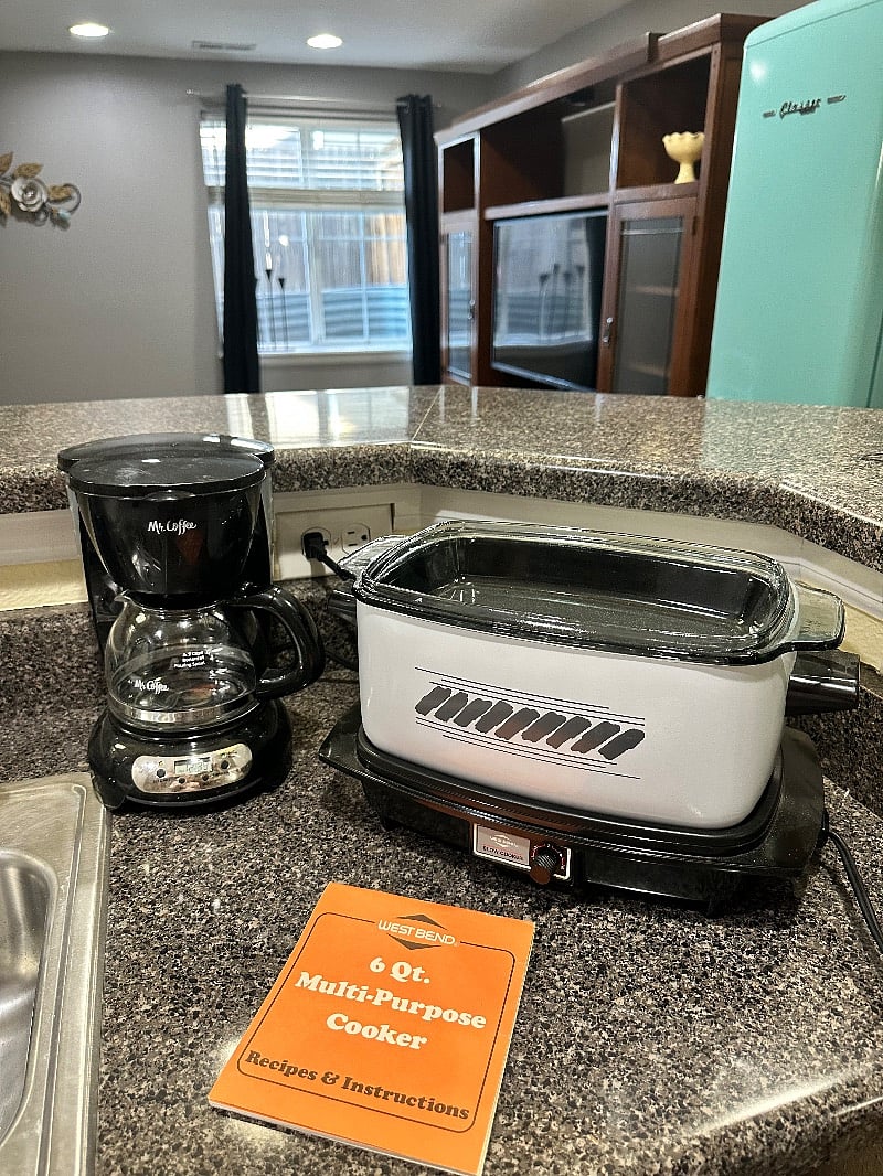 Coffee pot. Multi cooker functions as a slow cooker, stovetop pot, and electric griddle.