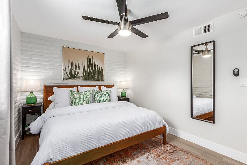 A tall dresser is not shown but provided for additional storage. 