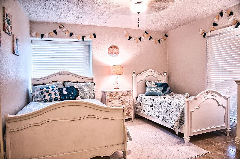 This room has a full bed and a twin bed.  It has a walk in closet as well.