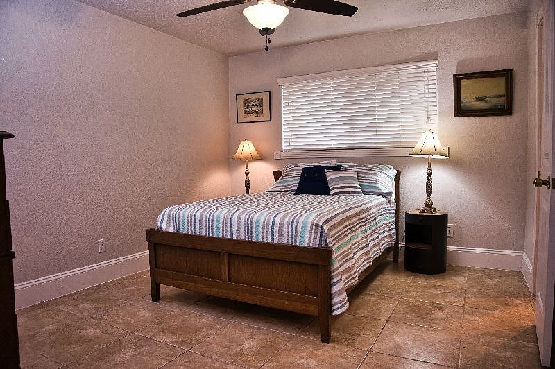 A full size bed in here has a private 1/2 bath and shared tub/shower combo. There is a walk in closet available in this room also.