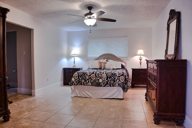 This is the master suite with a private bathroom with a shower and a walk in closet.