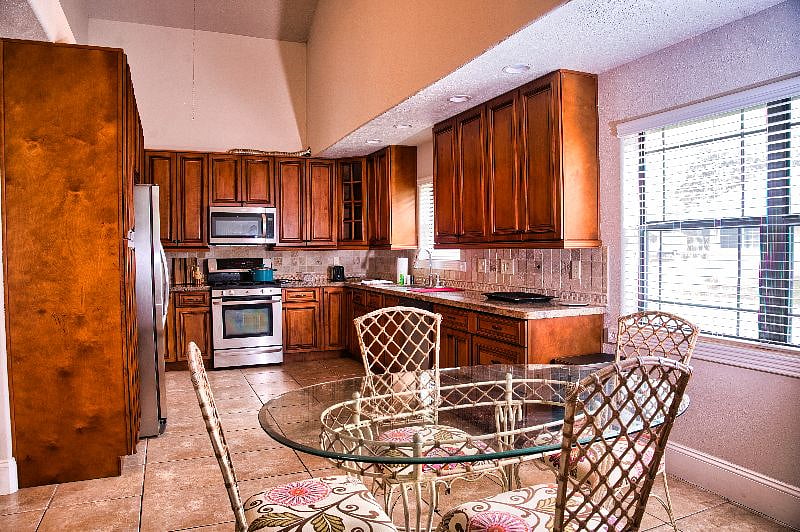 The kitchen has seating for 6 as well as a desk area.  The laundry room is off the kitchen.