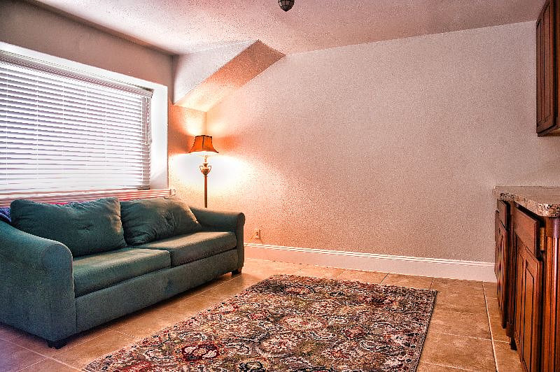 This additional sitting area has games, a TV console, a full size pull out couch and a desk area.