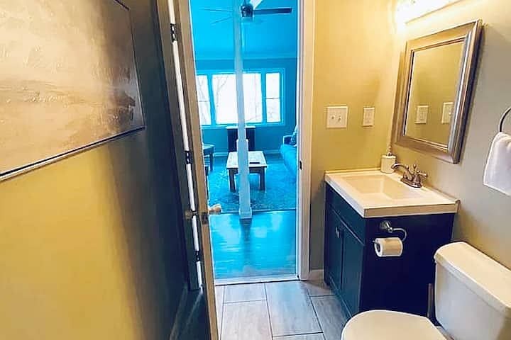 View from upstairs bathroom into living room