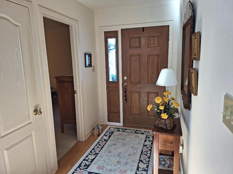 Front door entry, room at left in photo