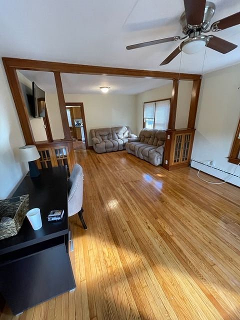 Spacious living area with a desk and 2 comfortable couches