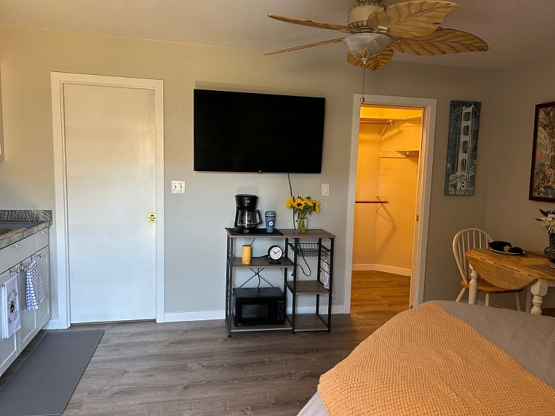 Large TV with access to streaming apps and under TV storage. 