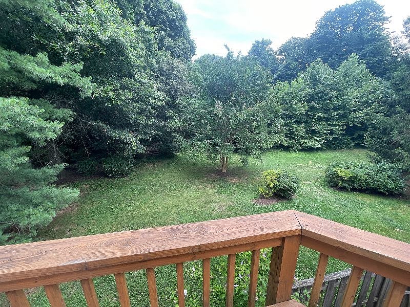 Outside back -- all common space shared by the community with some walking trails behind house in the woods