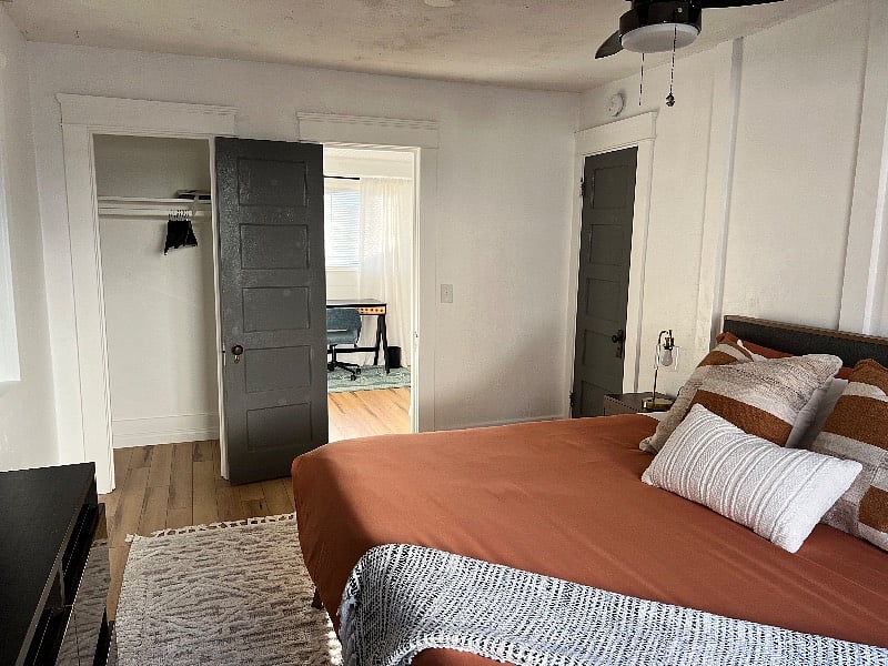 Closet in main bedroom with direct access to bathroom.