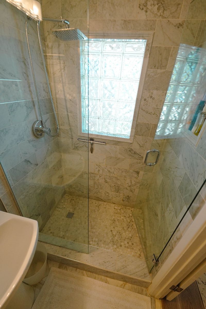 Master bedroom with ensuite bathroom features a rainshower