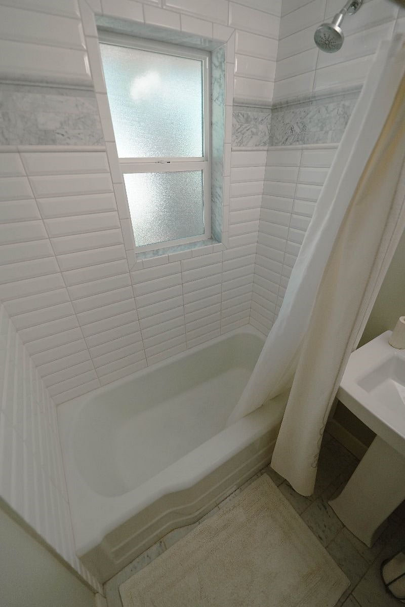 Tub and shower combo in bathroom 2