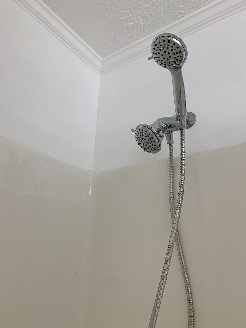 New shower head with 4 different adjustible jet settings.