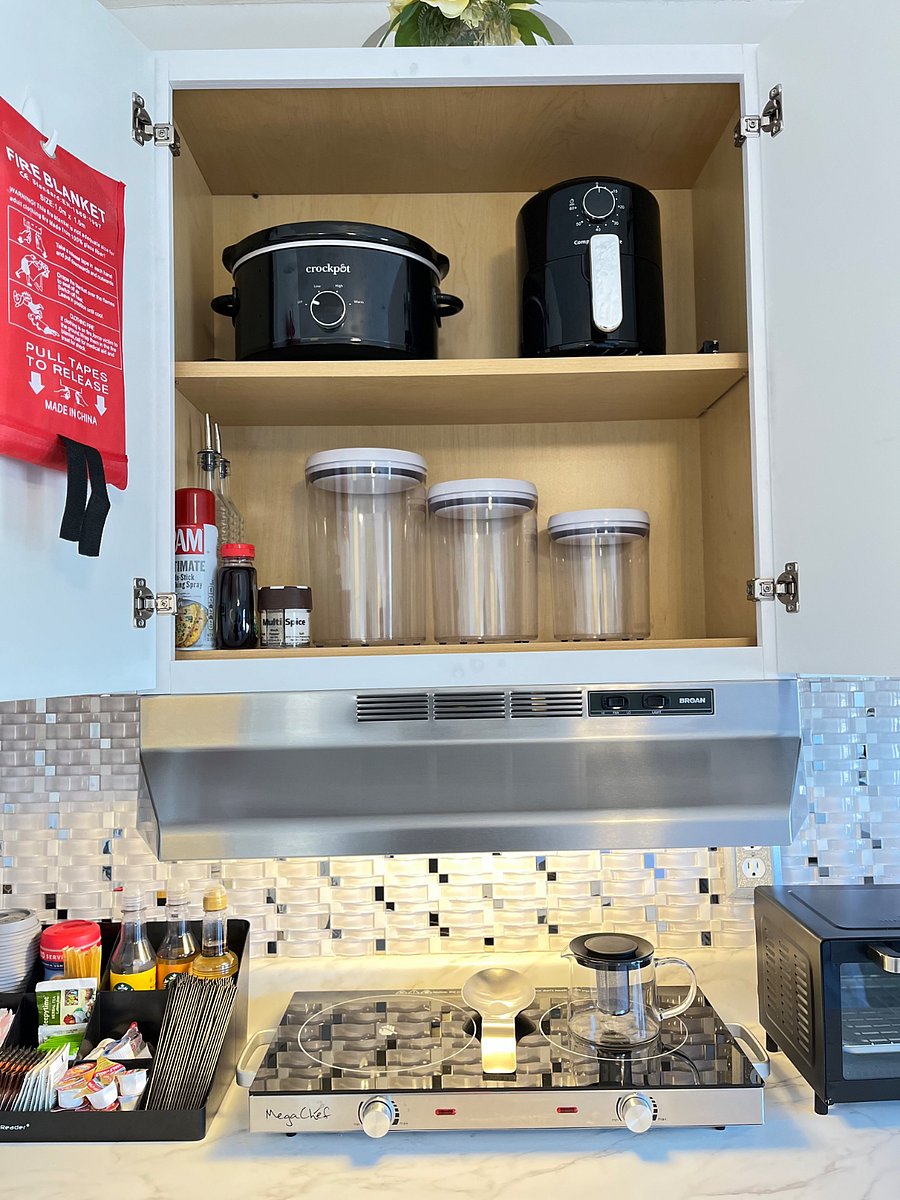 Emergency fire blanket, Pam cooking oil, maple syrup, assorted spices, storage containers, crockpot with plastic crockpot insert bags for easy cleanup, air fryer, glass tea kettle