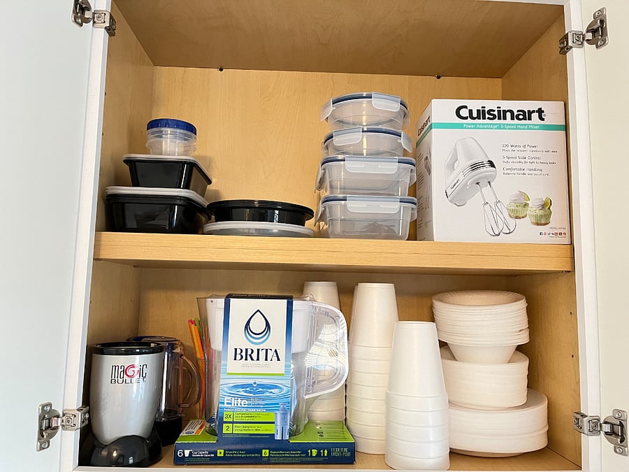 Brita water filter, Complimentary plastic storage containers, paper cups, plates, bowels, and straws.  Hand mixer, and  bullet mixer.