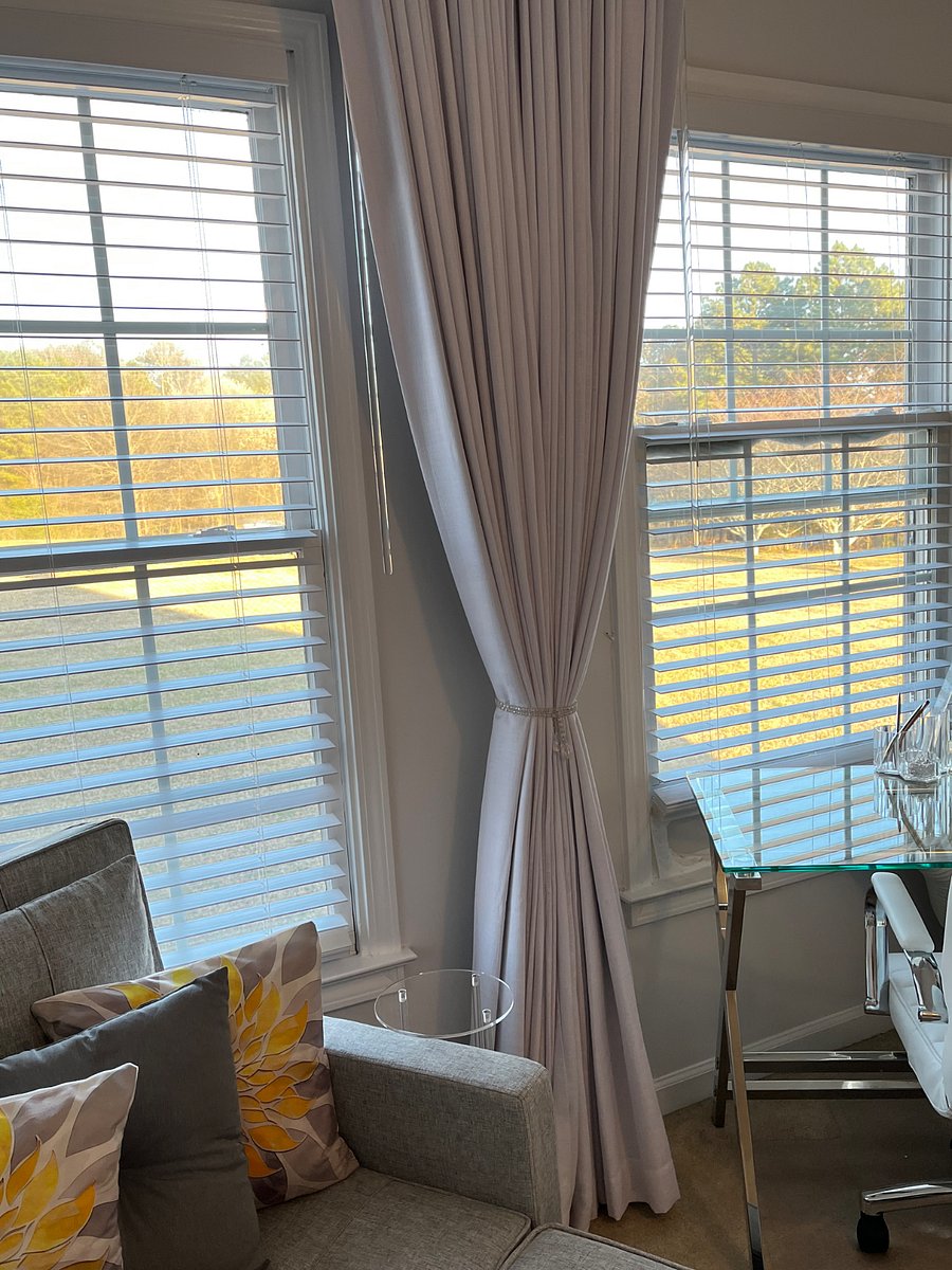 Room darkening blinds and heavy high quality room darkening drapes. 