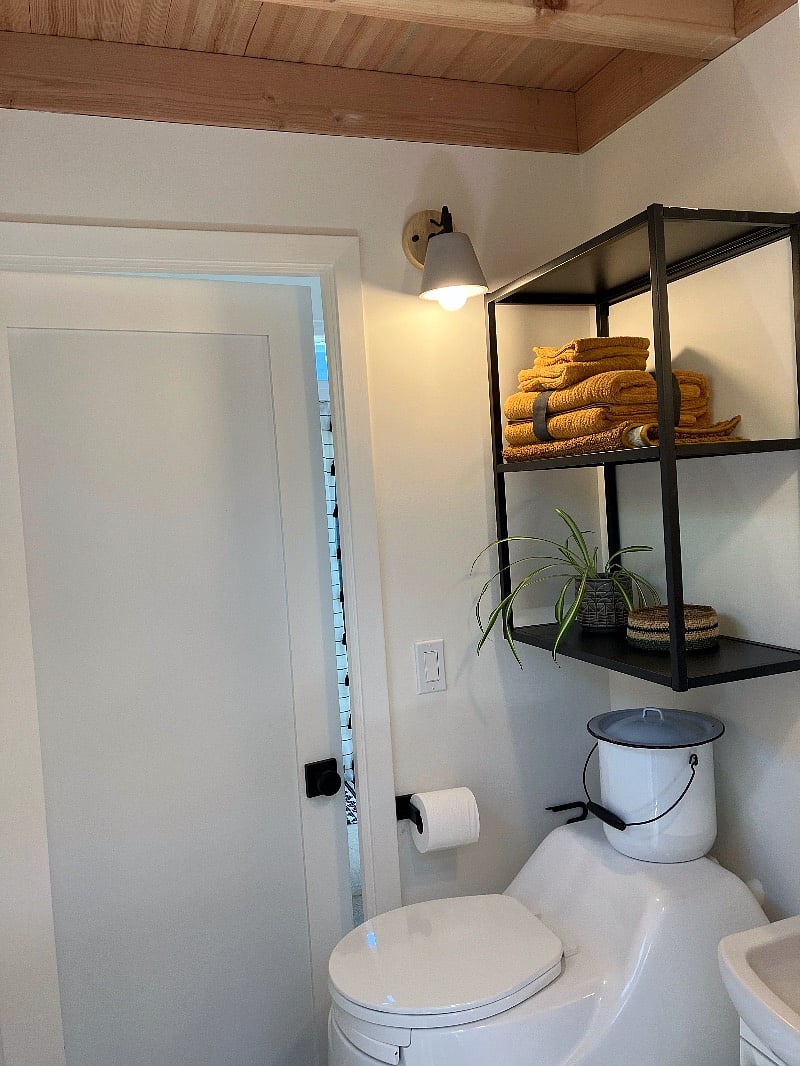 Modern composting toilet (no odor and low maintenance), with bathroom shelves