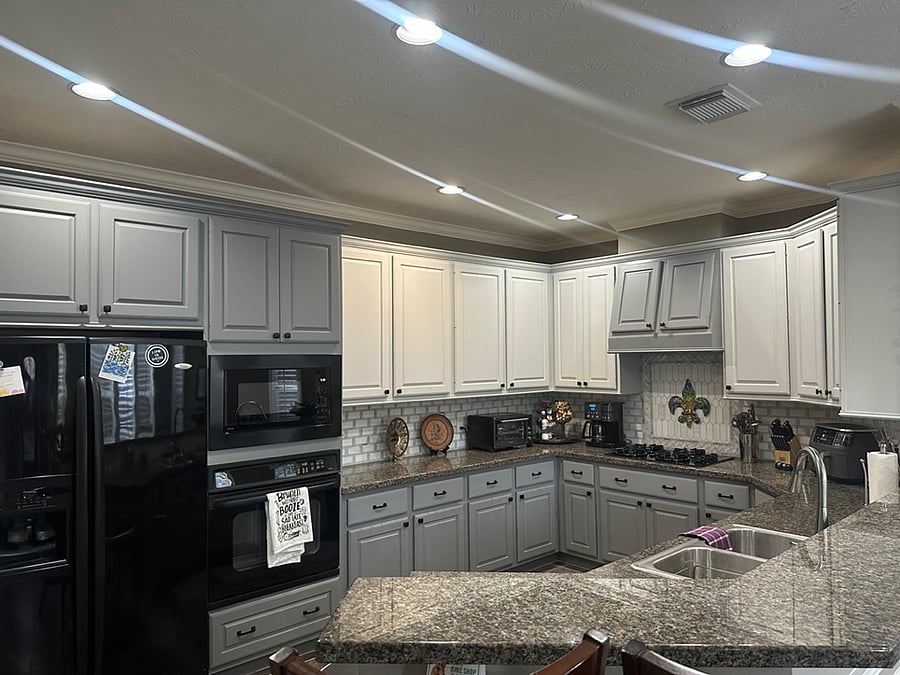 Well-appointed kitchen with modern appliances and generous workspace. The large walk-in pantry provides extensive storage and cooking equipment, making it easy to prepare everything from simple meals to full home-cooked dinners.