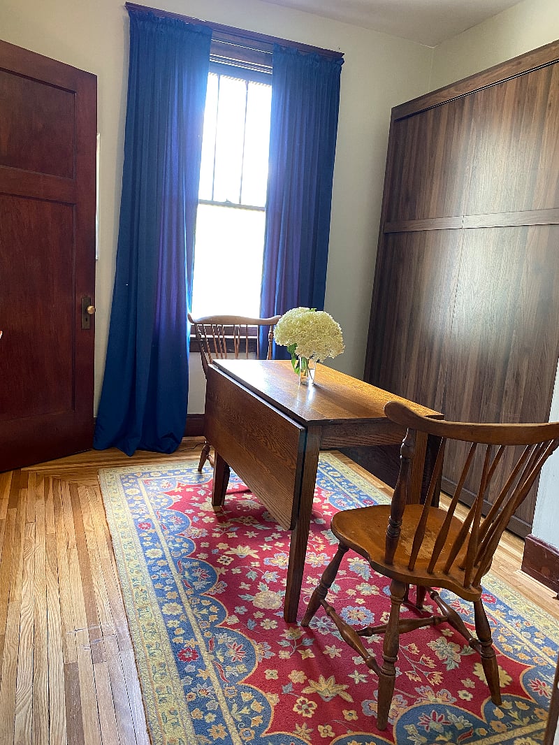 Bedroom 2: set up as a dining room/office, table leaves folded in.