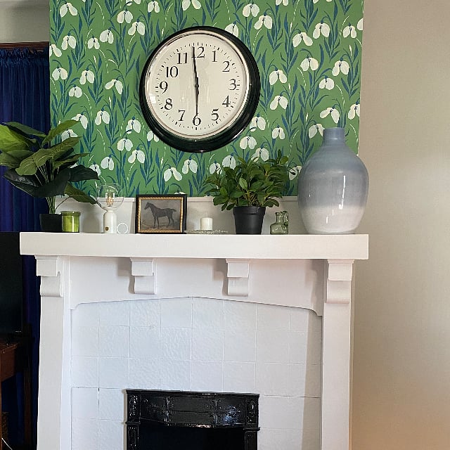 Livingroom with decorative fireplace.