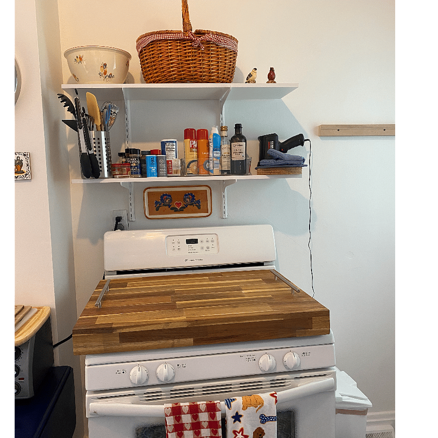 Gas range with removable butcher block cover, which provides more counter space as needed.