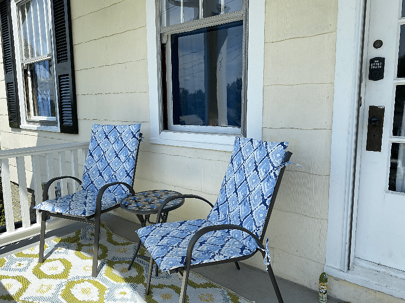 A sweet front porch with lovely views.
