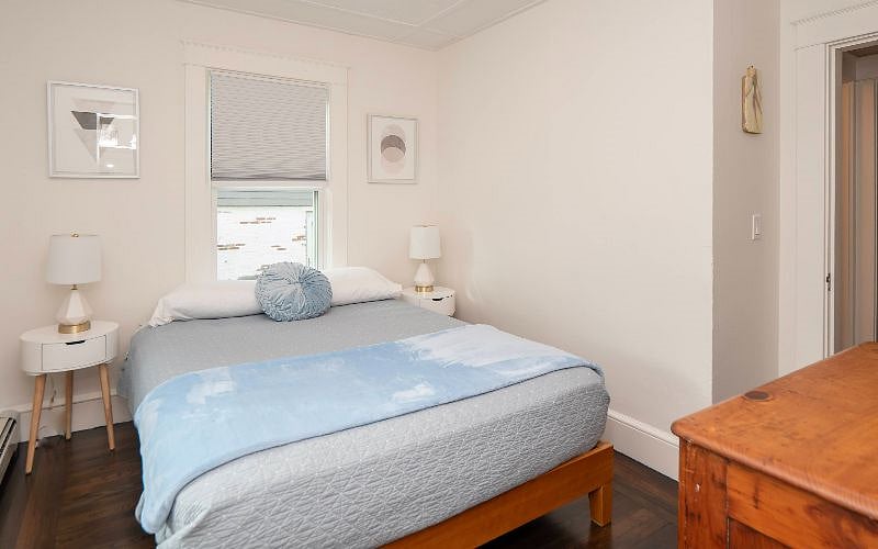 Second queen bedroom with dresser and nightstands