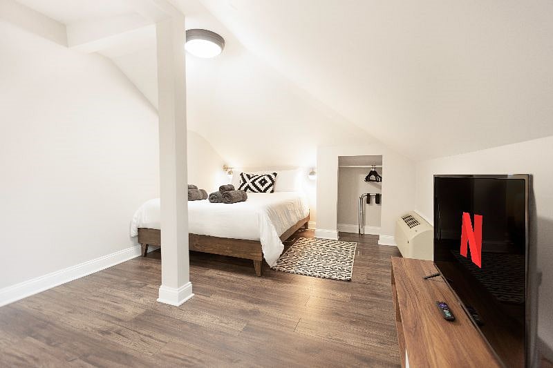 The middle bedroom has a queen size bed, small closet space and smart TV for relaxing and unwinding.