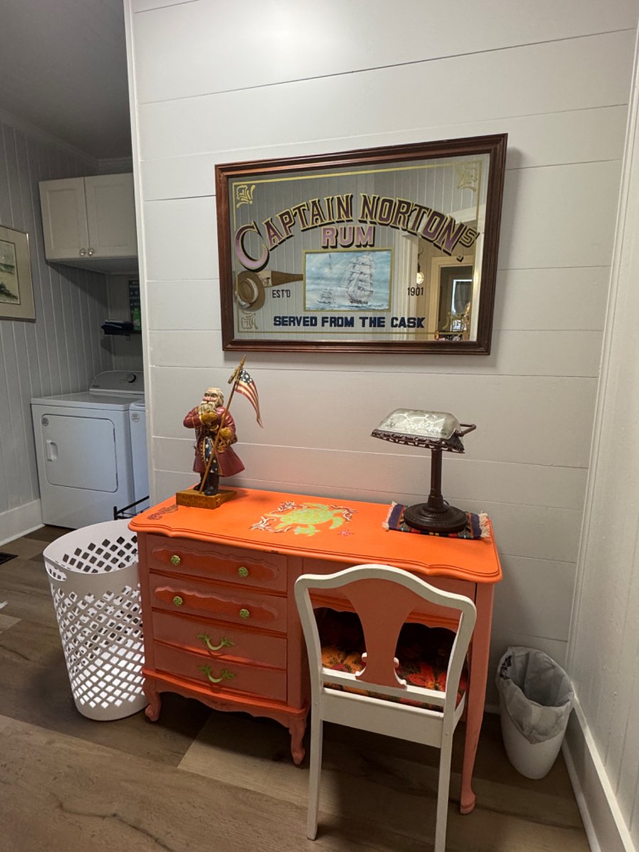 Large Laundry room with office desk and back door to outside shower