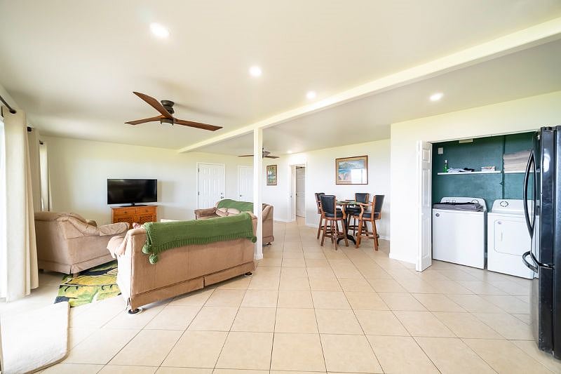 Full size washer and dryer behind folding doors